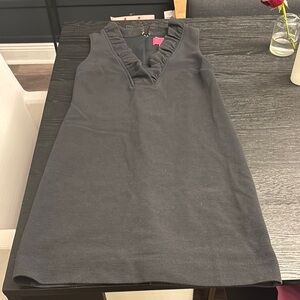 Black Sleeveless Dress with Ruffle Neckline